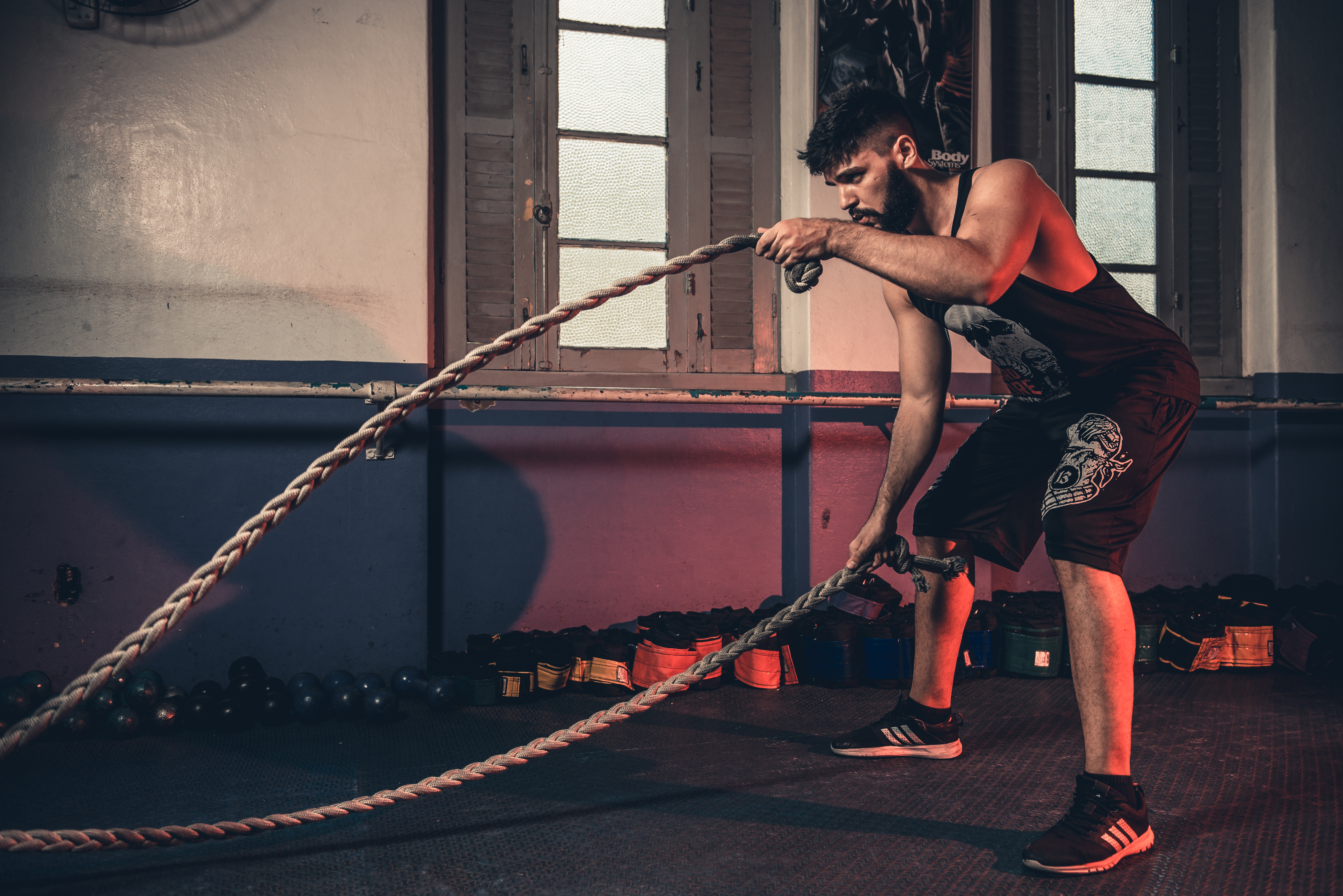 Photo of one of the members using our giant ropes for conditioning.