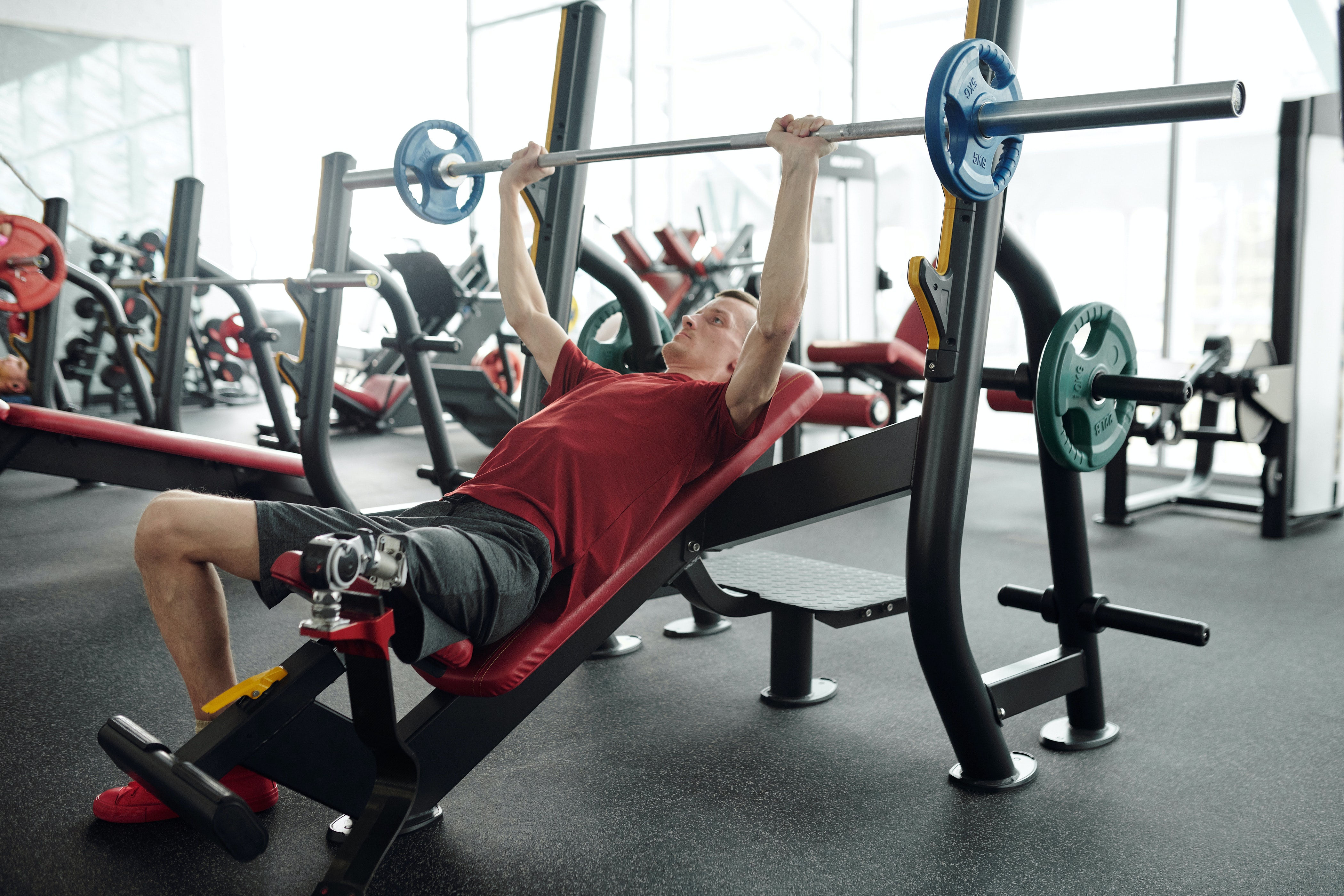 Photo of one of the members doing doing incline benchpress.